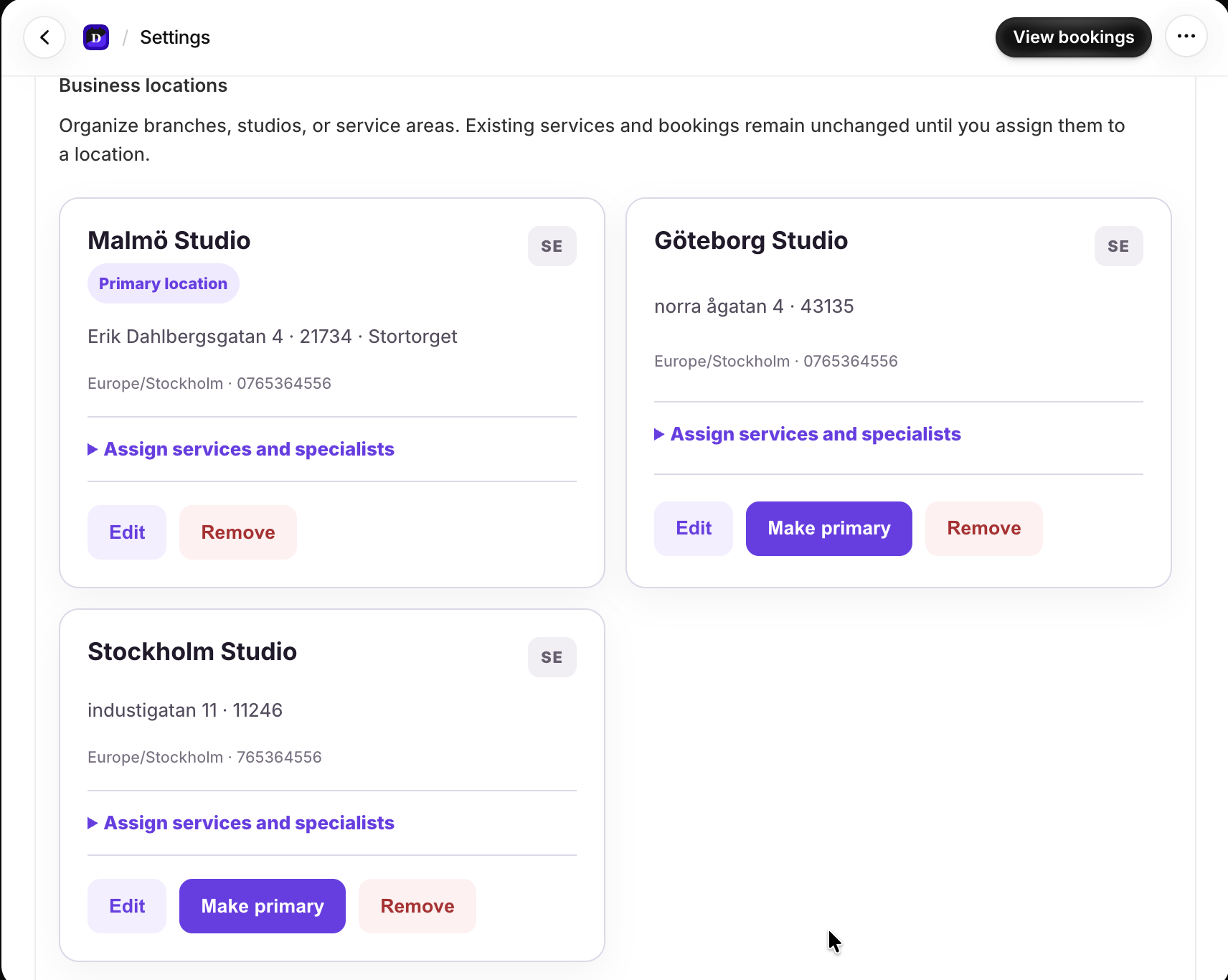 Dollflow Business locations page with three studios and assignment controls